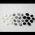24 White ceramic pebbles
