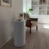 ScandiFlames Dualis bioethanol fireplace with a white fireplace body and a cylindrical safety glass