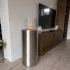 ScandiFlames Dualis bioethanol fireplace with a brushed steel fireplace body and a cylindrical safety glass