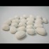 24 White ceramic pebbles